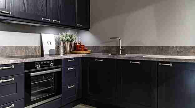 One of the most versatile flooring options to incorporate while designing a kitchen is dark floors.