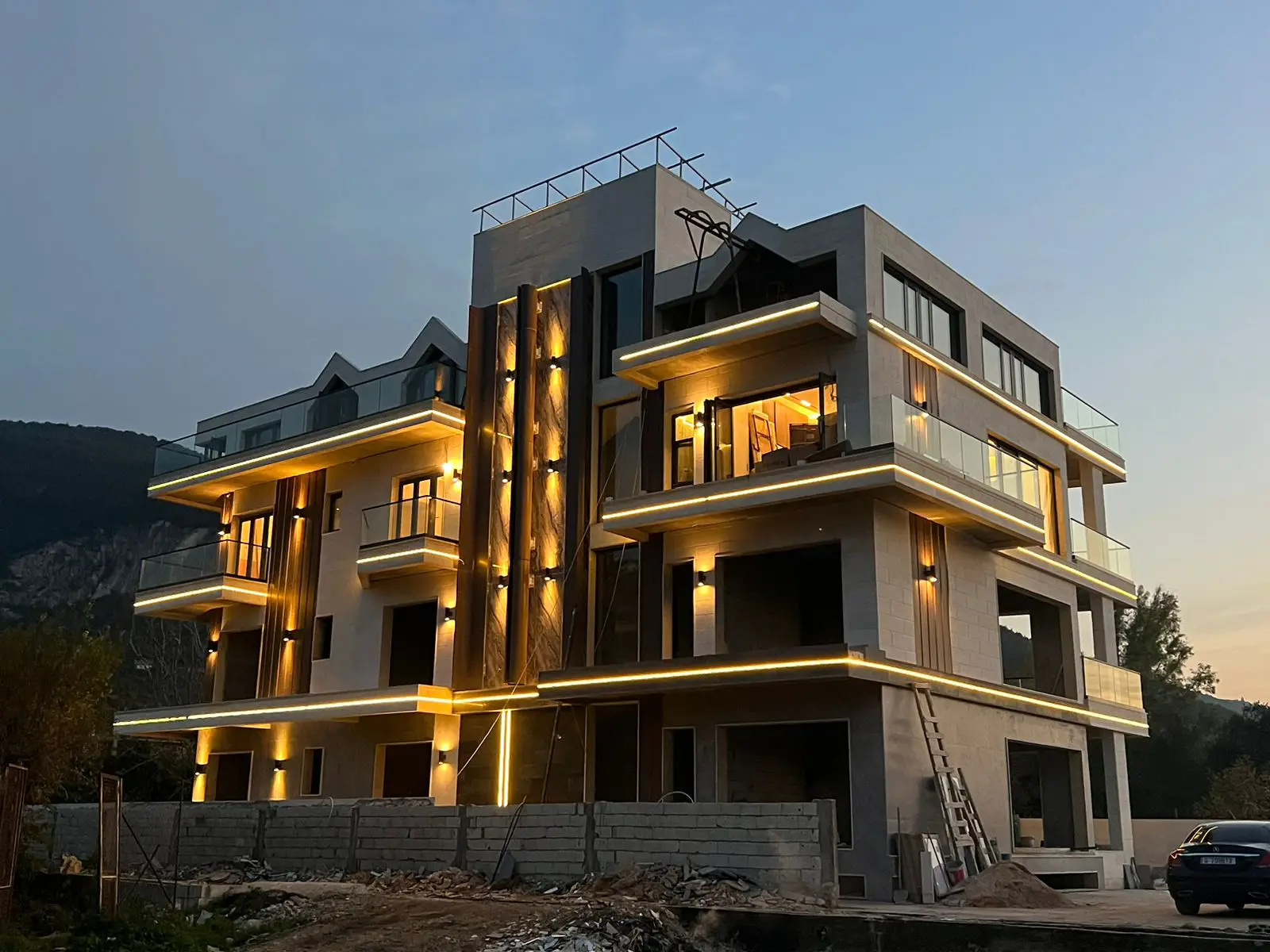 Dark aluminum windows and glass railings on luxury villa exterior
