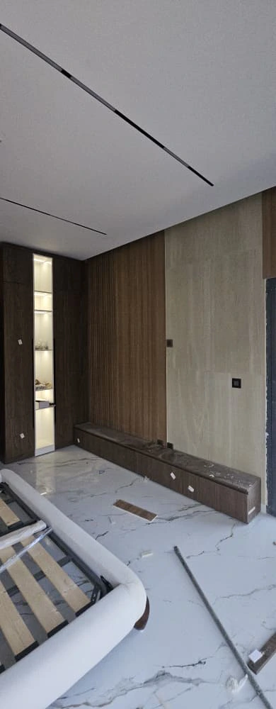 Coordinated bedroom furniture and custom wall panels for Lebanon villa