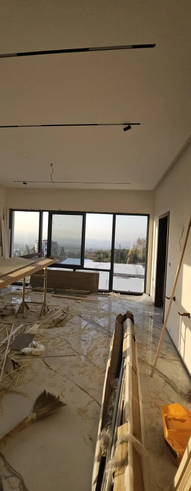 Marble-look slabs installed in Lebanon villa living room