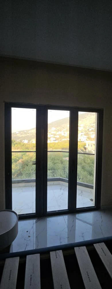 Coordinated exterior balcony matching dark window frames